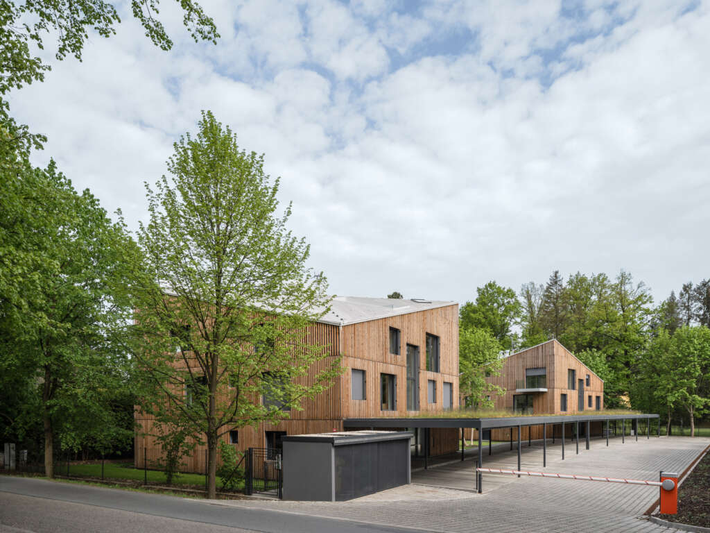 NEW HOW architects design angular apartments with wood slats in the Czech Republic