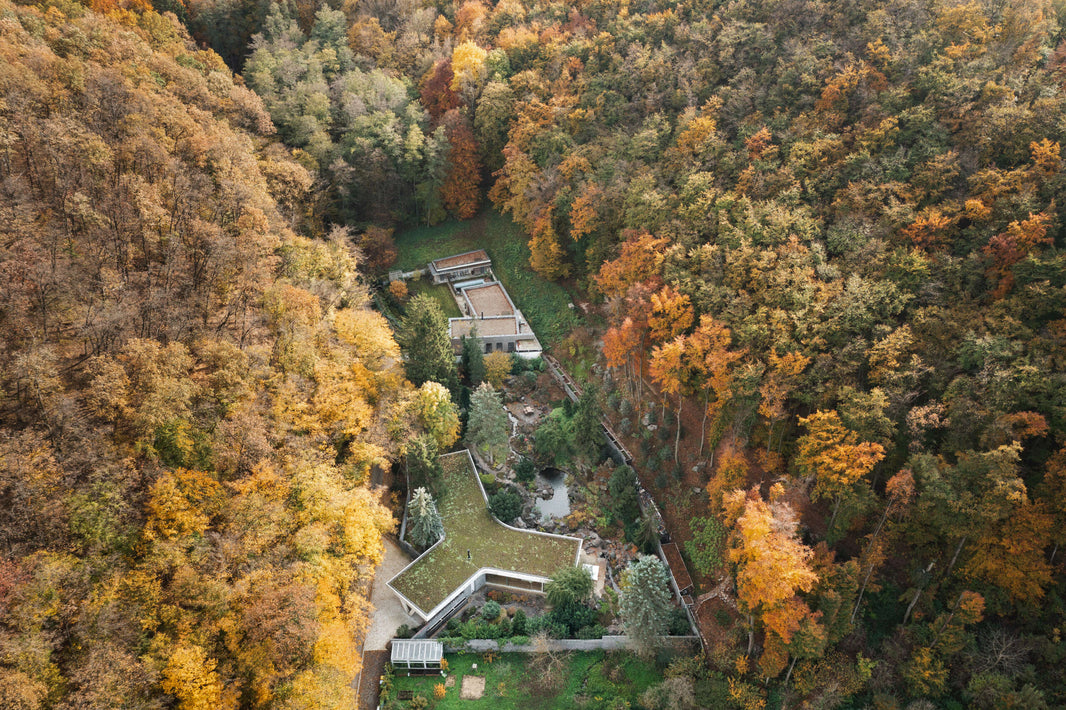 This getaway home in Slovakia uses raw materials and glass to create a seamless connection to the outdoors