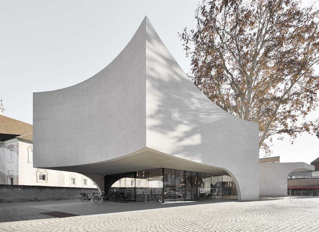 TreeHugger, a bold concrete building by MoDusArchitects, wraps public space with sinuous curves