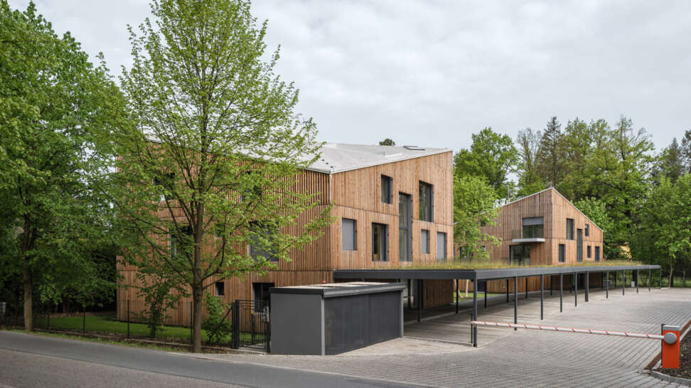 NEW HOW architects design angular apartments with wood slats in the ...